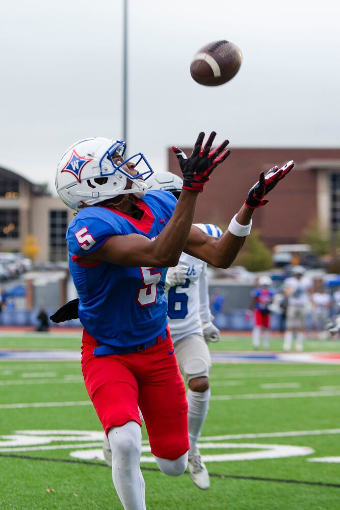 Ayden Jackson, senior on the Walton football team, catches the ball. CHRISTINA MATACOTTA FOR THE ATLANTA JOURNAL-CONSTITUTION.
