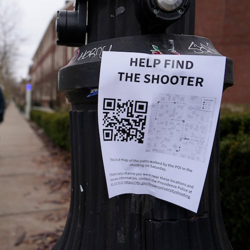 A poster seeking information about the campus shooting suspect is seen on the campus of Brown University, Wednesday, Dec. 17, 2025, in Providence, R.I. (AP Photo/Robert F. Bukaty)