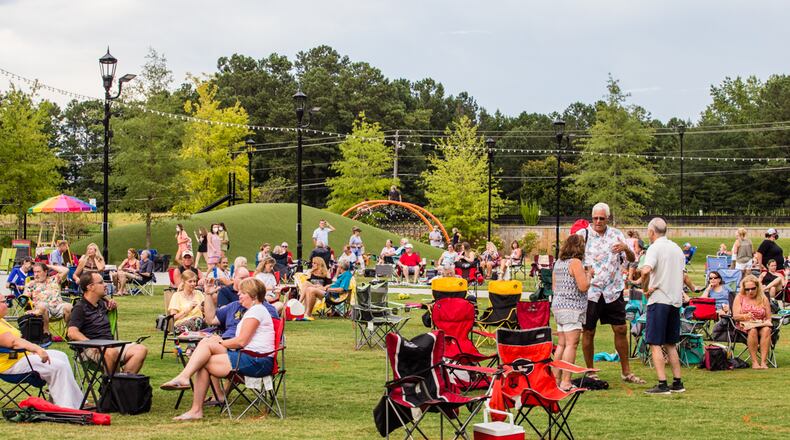 Peachtree Corners holds its first concert of the 2020 Town Green Concert Series with Electric Avenue performing live on Saturday, July 25, 2020.  Groups of 6 and 4 people pods  enjoyed food and drinks without masks during the show and were spaces 6 feet apart.  Masks were required when moving to vendors, between bathrooms and to cars; dancing was allowed within your designated space.   (Jenni Girtman for The Atlanta Journal-Constitution)