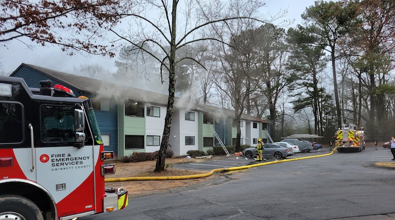 Gwinnett County firefighters extinguished a blaze at the Terra at Norcross apartments after receiving a call from a plumber who noticed smoke in a water heater closet.