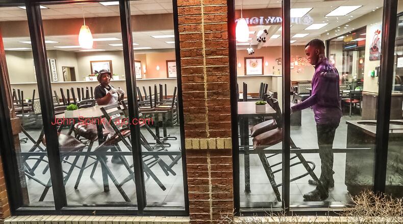 Dining-room chairs being stacked early Monday morning at a Chick-fil-A on 1901 Peachtree Rd NE in Atlanta.