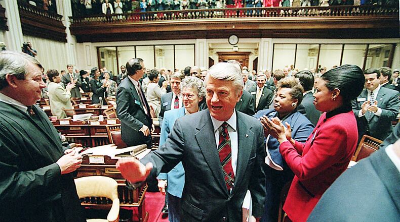 Then-Gov Zell Miller gets an enthusiastic greeting from representatives filling the House Chambers for his 1991 State of the State address. In his address three years later, the governor promised a crackdown on teen lawbreakers he called punks, hoodlums and thugs. AJC File Photo