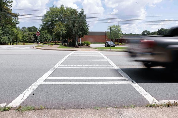 A crosswalk on Jamerson Road, just outside Davis Elementary School, is near where Preston Veal went to play basketball the day he was struck by a cargo van in June. (Natrice Miller/AJC)