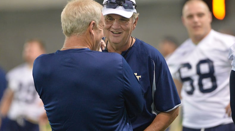 August 4, 2016 Atlanta - Georgia Tech Yellow Jackets head coach Paul Johnson shares a smile with Andy McCollum (foreground), Safeties/Recruiting Coordinator, during the first day of practice at Rose Bowl Field in Georgia Tech campus on Thursday, August 4, 2016. HYOSUB SHIN / HSHIN@AJC.COM