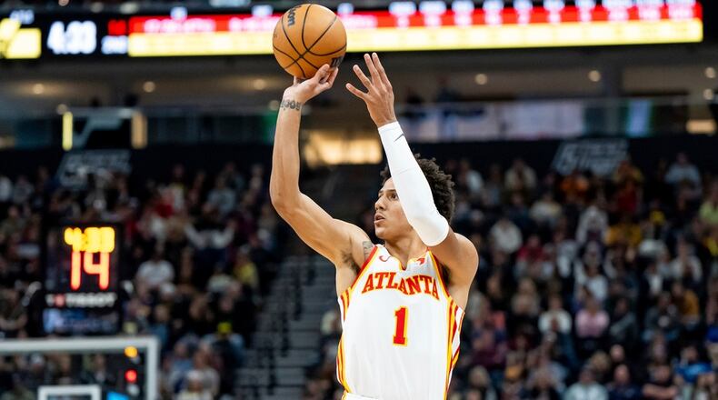 Atlanta Hawks forward Jalen Johnson (1) shoots during the first half of an NBA basketball game against the Utah Jazz, Friday, March 15, 2024, in Salt Lake City. (AP Photo/Spenser Heaps)