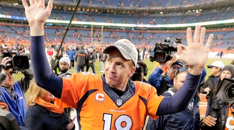 Denver Broncos quarterback Peyton Manning waves to spectators following the NFL football AFC Championship game between the Denver Broncos and the New England Patriots, Sunday, Jan. 24, 2016, in Denver. The Broncos defeated the Patriots 20-18 to advance to the Super Bowl. (AP Photo/Charlie Riedel)