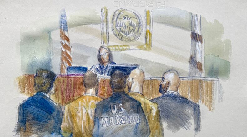 In this courtroom sketch Andrew and Tristan Tate appear with their attorneys before judge Lauren Louis in Miami federal court, Monday, July 20, 2026, in Miami. (Lothar Speer via AP)