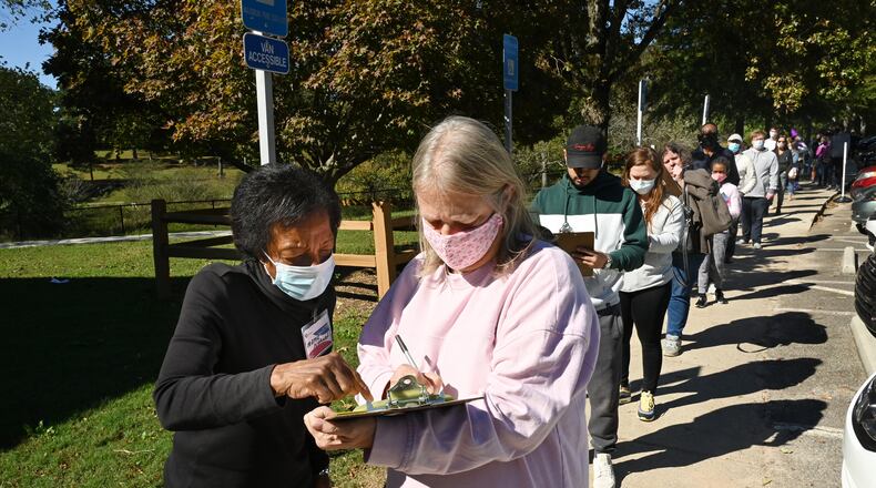 Gwinnett County voters wait in line to cast their ballots at the Shorty Howell Park Activity Building in Duluth on the last day of early voting on Oct. 30, 2020. On Thursday, Jan. 27, 2022, a Georgia Senate committee approved a proposal by GOP Sen. Clint Dixon, of Gwinnett, to make that county's school board elections nonpartisan. (Hyosub Shin/Atlanta Journal-Constitution/TNS)