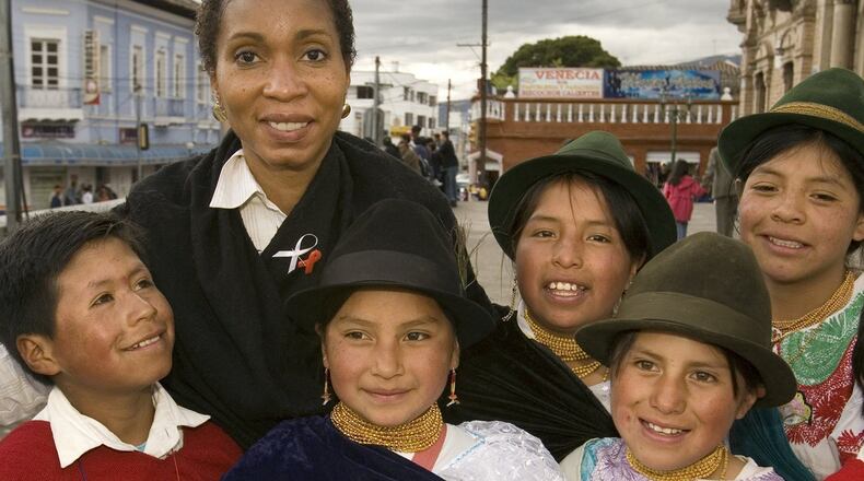 CARE CEO Dr. Helene Gayle with children in Ecuador. She's led CARE since 2006.