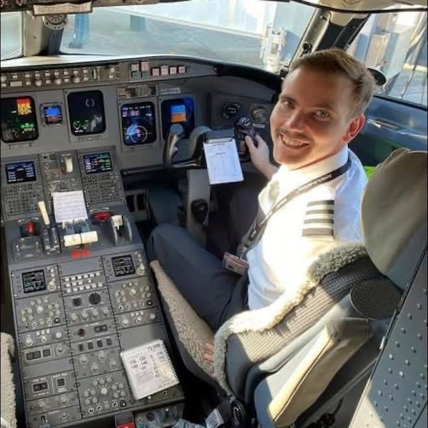 In this undated image released by the Lilley family, Sam Lilley, copilot of the American Airlines plane that collided with a helicopter recently in Washington D.C., is seen in an airplane cockpit. (Lilley Family via AP)