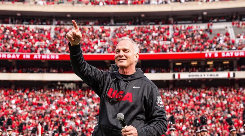 Former Georgia coach Mark Richt gestures to the crowd when he was honored at halftime of the Bulldogs’ game against Missouri at Sanford Stadium in Athens on Saturday, Nov. 6, 2021. (Photo by Tony Walsh/UGA Athletics)