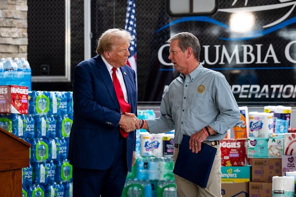 Georgia Gov. Brian Kemp (right) — pictured with President Donald Trump during a talk about Hurricane Helene recovery in October 2024 — has managed to walk the political tightrope of keeping Trump at arm's length without antagonizing the president or his voting base. (Doug Mills/N.Y. Times 2024)