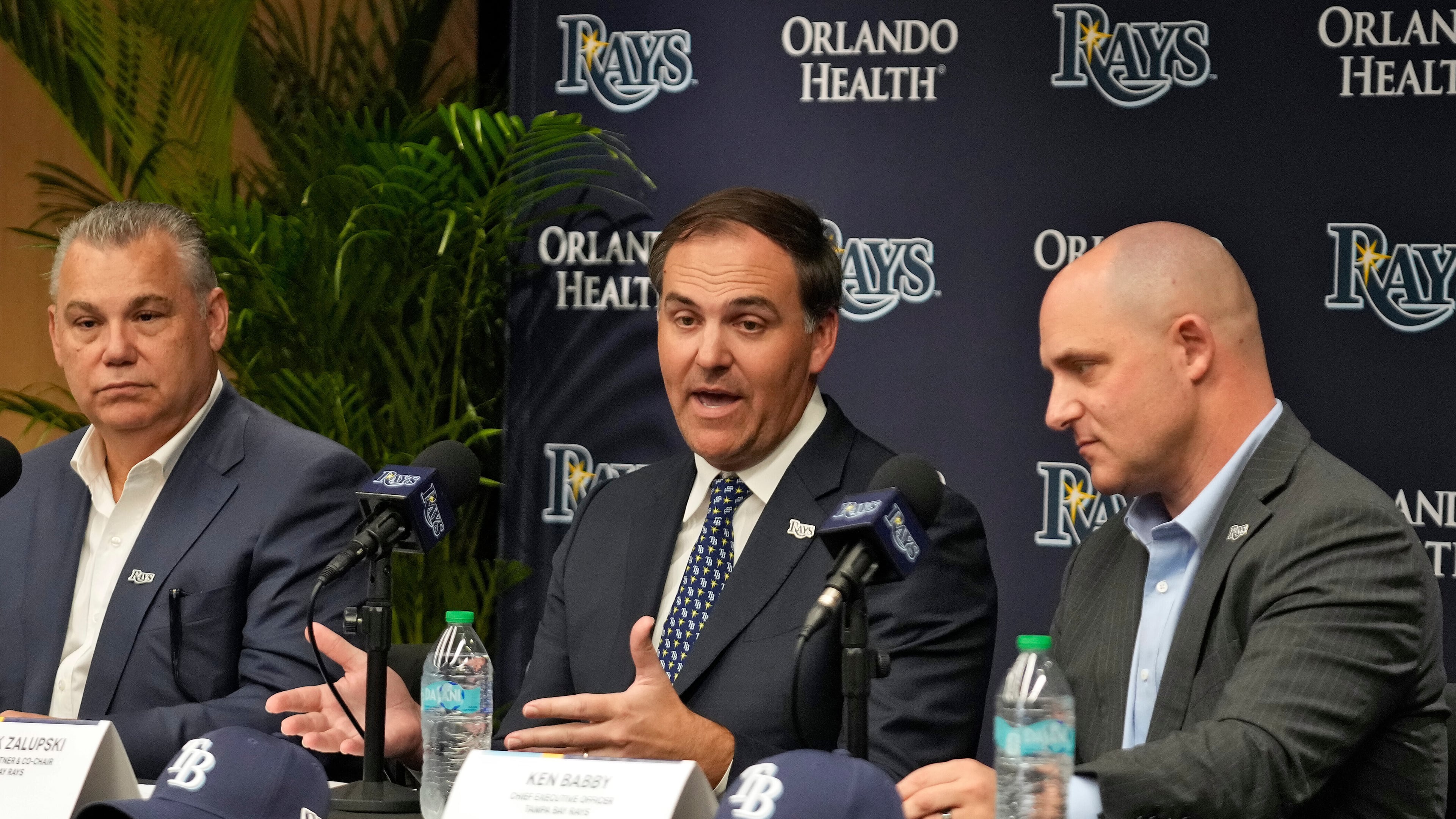 New Tampa Bay Rays ownership managing partner and co-chair Patrick Zalupski, center, answers a question, as co-chair Bill Cosgrove, left, and chief executive officer Ken Babby, right, look on during an introductory baseball news conference, Tuesday, Oct. 7, 2025, in Tampa, Fla. (AP Photo/Chris O'Meara)