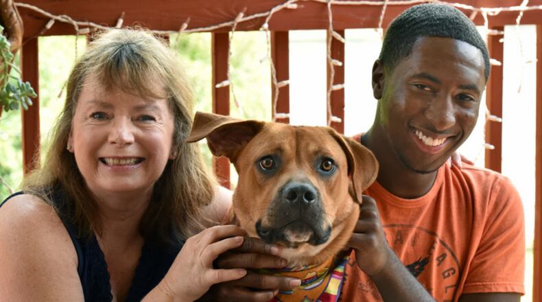Vicki Van Der Hoek (left) and Leon Shields with Vicki's dog Bobby as Leon visits Vicki's home in Morrow on Thursday, August 27, 2015. HYOSUB SHIN / HSHIN@AJC.COM