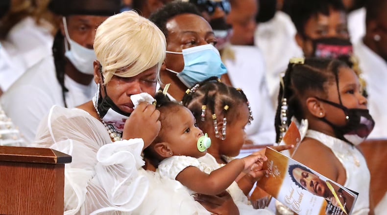 Tomika Miller, the wife of Rayshard Brooks, weeps while holding their 1-year-old daughter Dream during his funeral in Ebenezer Baptist Church on Tuesday, June 23, 2020 in Atlanta. Brooks, 27, died June 12 after being shot by an officer in a Wendy's parking lot. Brooks' death sparked protests in Atlanta and around the country. Curtis Compton ccompton@ajc.com