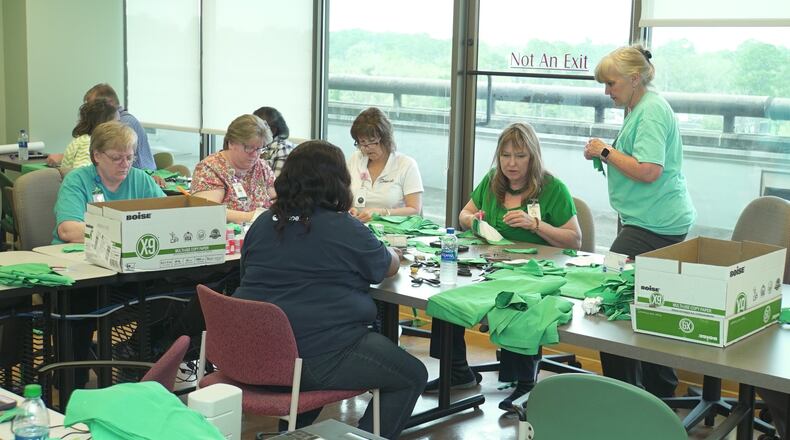 Workers at Phoebe Putney Health System in Albany volunteered to sew medical masks as the nation’s supply of protective equipment for healthcare workers runs dry. In the midst of the spread of COVID-19, the disease caused by the novel coronavirus, Phoebe Putney believes it has supplies for a few more days but none after that. It’s already sourcing protective gowns from connections in the restaurant industry and bleach from chicken plants. It finally has supplies to test patients and employees for the disease but LabCorp, which is doing the testing, appears overwhelmed and hundreds of test results remain pending days later. Photo from Tuesday, March 17, 2020.