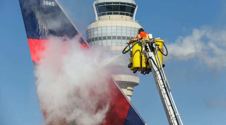 January 7, 2017 Hartsfield-Jackson International Airport : Hartsfield-Jackson International Airport crews had 93-thousand gallons of de-icing fluid to spray on planes on their 16-pads where planes that parked overnight were de-iced before taking off on Saturday January 7, 2017.The anticipated snowstorm for metro Atlanta and beyond never came, and instead many people woke up Saturday disappointed by the lack of snow and toÊface potentially dangerous icy conditions on the road.Ê Even so, metro Atlanta roads warmed as temperatures rose throughout the morning. Georgia Power said it restored power to 36,000 customers overnight. But as winds kicked up Saturday morning, the number of affected customers roughly doubled in an hour, from about 8,000 at 8 a.m. to more than 15,000. Shortly after 10 a.m. Saturday,ÊGeorgia PowerÕs outage mapÊshowed a smaller number of customers, 14,587, were still without power, after freezing rain and snow swept through the area overnight. JOHN SPINK /JSPINK@AJC.COM