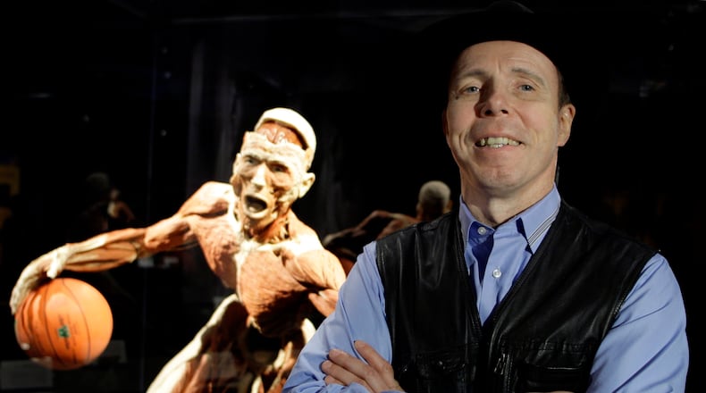 FILE - Doctor Gunther von Hagens, anatomist, inventor of and creator of Body Worlds The Original Exhibitions of Real Human Bodies known as Germany's 'Dr Death' , is seen in front of one of his works in Istanbul, Turkey, Friday, June 11, 2010. (AP Photo/Ibrahim Usta, file)