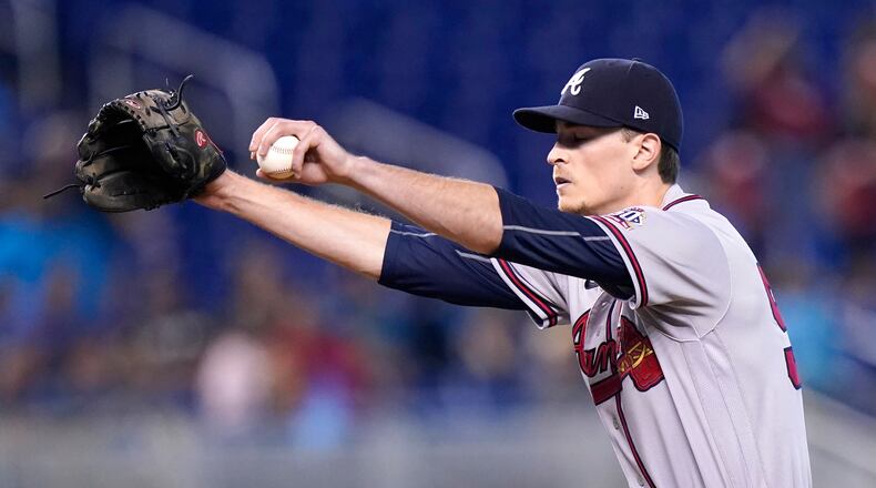 Atlanta Braves starting pitcher Max Fried stretches on the mound after giving up a double to Miami Marlins' Adam Duvall during the first inning of a baseball game, Saturday, July 10, 2021, in Miami. (AP Photo/Lynne Sladky)