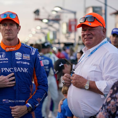 FILE - Scott Dixon, left, stands next to Chip Ganassi before the start an IndyCar auto race at World Wide Technology Raceway on Aug. 21, 2021, in Madison, Ill. (AP Photo/Jeff Roberson, File)