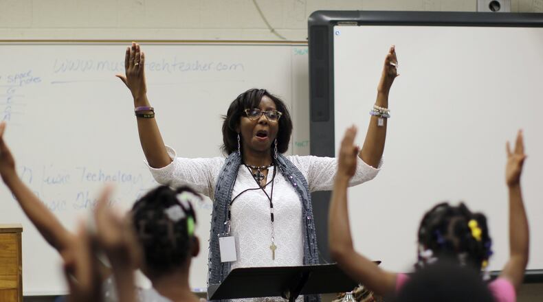 Third-graders practice in Letricia Henson’s music and chorus class in Thomasville Heights Elementary School, the first school to be part of APS’ outsourcing experiment. A group called Purpose Built Schools took over the school this year. Among the changes at Thomasville are intensive instruction in reading/math; pre-K programs; daily “specials” including dance and robotics and a team of parents working at the school to better connect staff with the community BOB ANDRES /BANDRES@AJC.COM