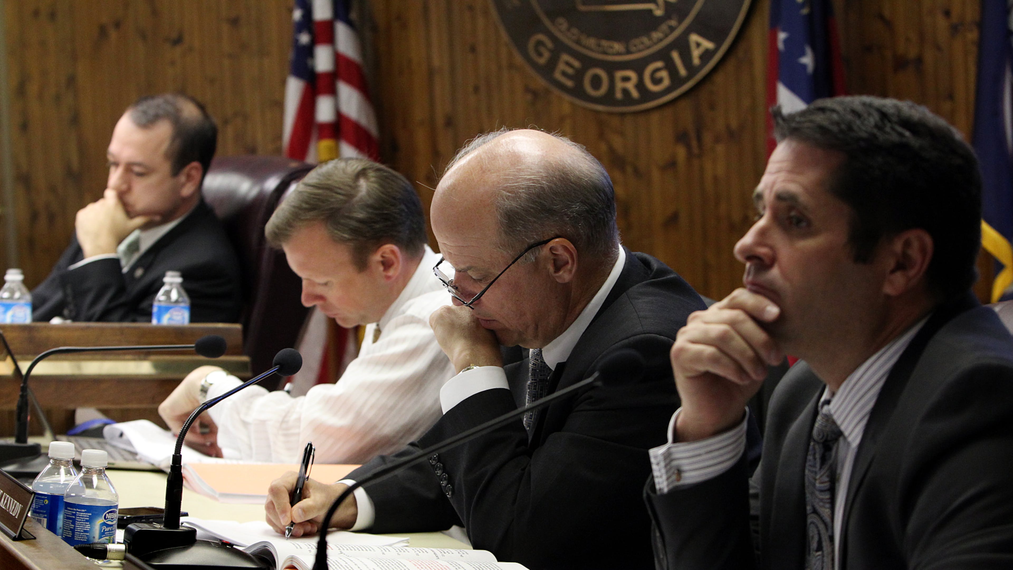 Mayor David Belle Isle (from left) and council members Chris Owens, Mike Kennedy and Donald F. Mitchell consider a request to develop an approximately 86 acre site on Old Milton Parkway and Georgia 400 named Avalon during a City of Alpharetta public hearing. (Curtis Compton/AJC 2012)