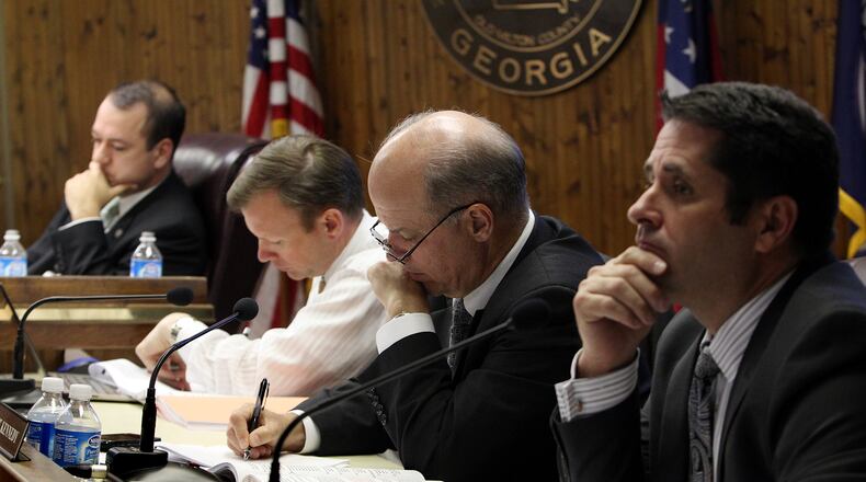 Mayor David Belle Isle (from left) and council members Chris Owens, Mike Kennedy and Donald F. Mitchell consider a request to develop an approximately 86 acre site on Old Milton Parkway and Georgia 400 named Avalon during a City of Alpharetta public hearing. (Curtis Compton/AJC 2012)
