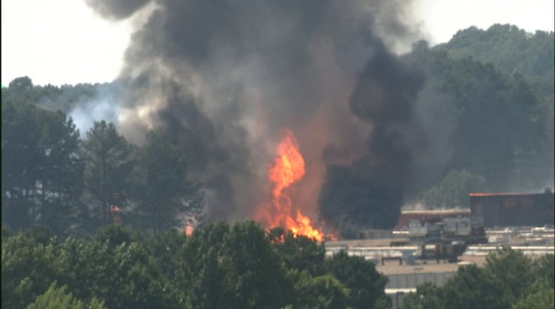 A massive fire sent a plume of smoke into the air near the Atlanta airport Friday afternoon.