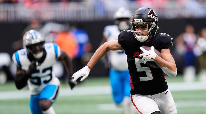 FILE - Atlanta Falcons wide receiver Drake London (5) carries against the Carolina Panthers in the first half of an NFL football game, Nov. 16, 2025, in Atlanta. (AP Photo/Mike Stewart, File)