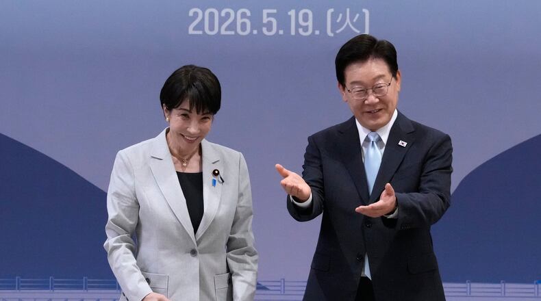 Japan's Prime Minister Sanae Takaichi, left, and South Kore's President Lee Jae Myung react during their meeting in Andong, South Korea, Tuesday, May 19, 2026. (AP Photo/Ahn Young-joon, Pool)
