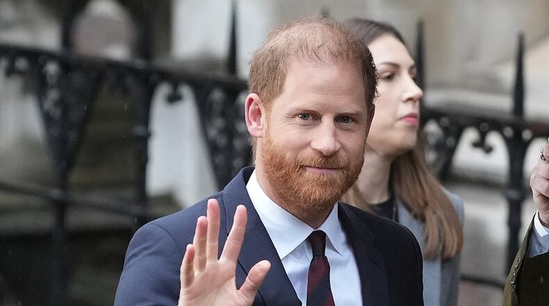 Britain's Prince Harry arrives at London's High Court to lead a group, including Elton John and Elizabeth Hurley, accusing the Daily Mail's publisher of privacy invasion through unlawful tactics in a trial that is part of a wider phone hacking scandal in London, Wednesday, Jan. 21, 2026. (AP Photo/Kirsty Wigglesworth)