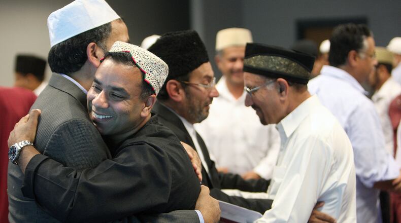 The Ahmadiyya Muslim community in Georgia observed the Muslim holiday of Eid Mubarak with family and friends at Lucky Shoals Park in Norcross several years ago. The motto of the Ahmadiyya Community is “Love for All, Hatred for None.” AJC FILE PHOTO 2012