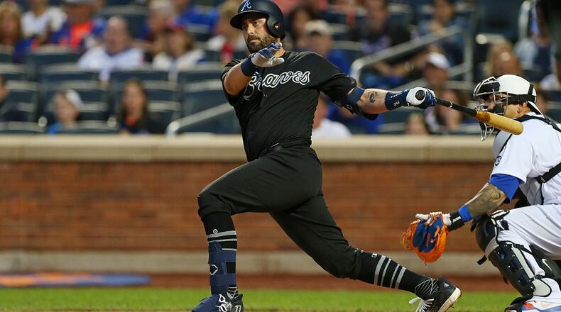 Francisco Cervelli of the Braves hits a two-run double against the New York Mets at Citi Field on August 24, 2019 in New York City. Teams are wearing special color-schemed uniforms, with players choosing nicknames to display, for Players' Weekend. (Photo by Rich Schultz/Getty Images)
