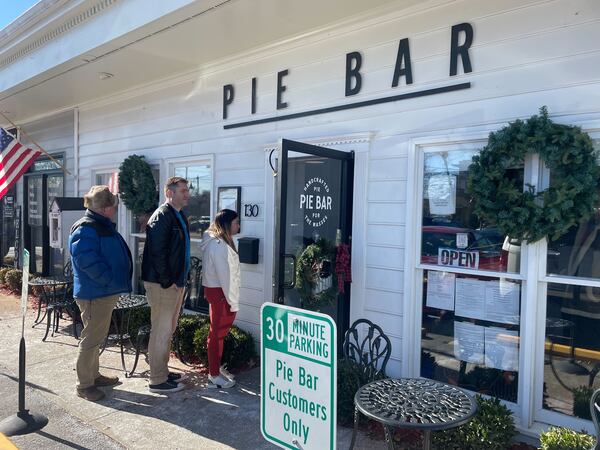 A line of customers extended out into the cold from Pie Bar's Woodstock location Friday as they flocked there for pickup orders after the Marietta location was burglarized.