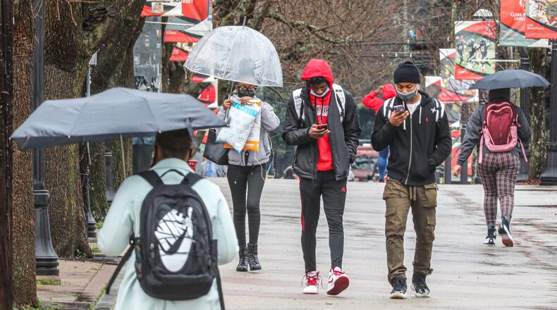 Students walked across the Clark Atlanta University campus on Feb. 23, 2022. Clark Atlanta and Morehouse College are partnering to provide degrees and certificates for minorities aspiring to become principals. (John Spink / John.Spink@ajc.com)
