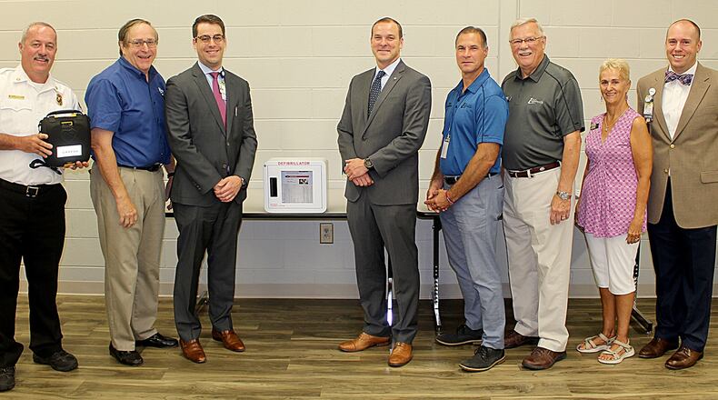 Loganville officials recently accepted a portable AED machine from Eastside Medical Center. (Courtesy Ciity of Loganville)