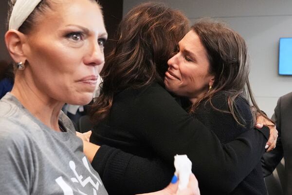 Victims, Keely Roberts, left, Sheila Gutman, center, and Dana Ruder Ring react during the sentencing hearing for Robert E. Crimo III., at the Lake County Courthouse, in Waukegan, Ill., Wednesday, April 23, 2025. (AP Photo/Nam Y. Huh, Pool)