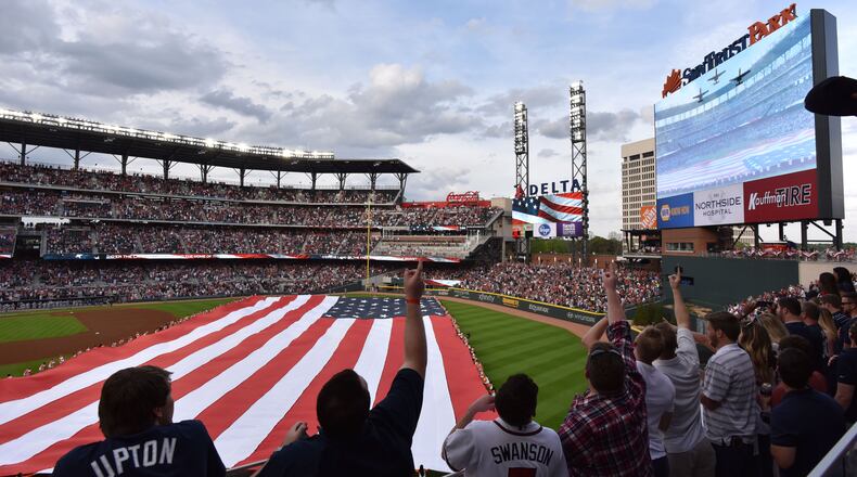 Atlanta Braves fans cheer before a game during SunTrust Park's opening weekend in 2017.