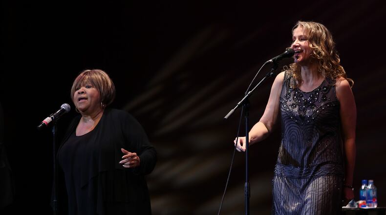 Mavis Staples and Joan Osborne sharing "The Weight." Photo: Akili-Casundria Ramsess/Special to the AJC.