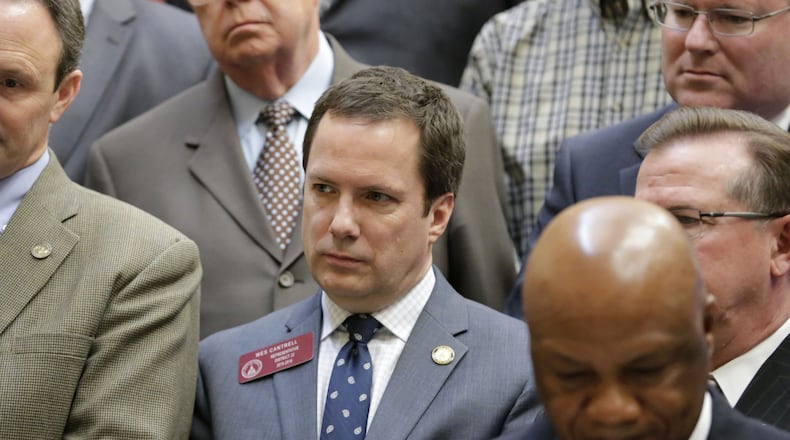 Rep. Wes Cantrell, center in this picture from March 2016, said victims of sexual abuse “go through years enduring something they should not have to endure.” Thirty-one states states already require the type of education for students that his bill seeks. BOB ANDRES / BANDRES@AJC.COM
