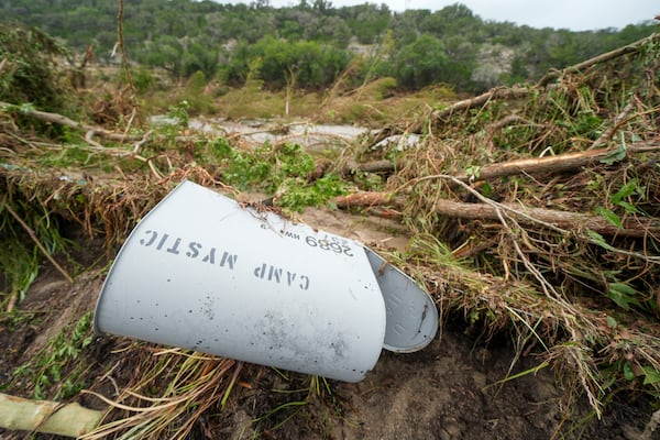 A Camp Mystic mailbox is seen near the entrance to the establishment along the banks of the Guadalupe River after a flash flood swept through the area Saturday, July 5, 2025, in Hunt, Texas. (AP Photo/Julio Cortez)
