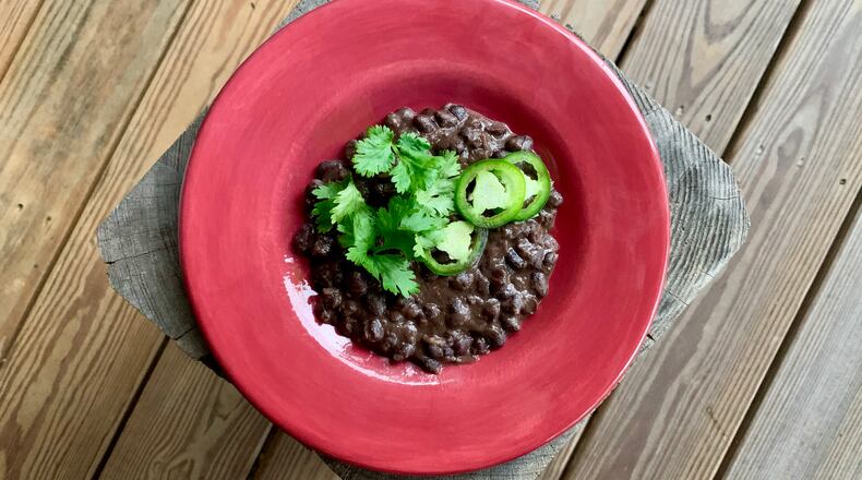 Warmly Spiced Black Beans is a side dish that will perk up your dinnertime. John Kessler for The AJC