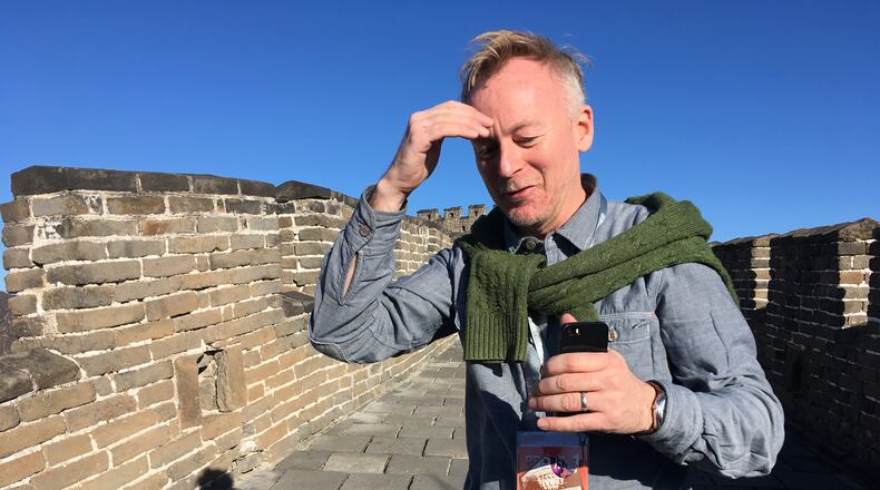 AP reporter Christopher Bodeen walks along the Mutianyu Great Wall section on the outskirts of Beijing, on Nov. 10, 2017, while covering Melania Trump’s visit to the wall. (AP Photo/Emily Wang)