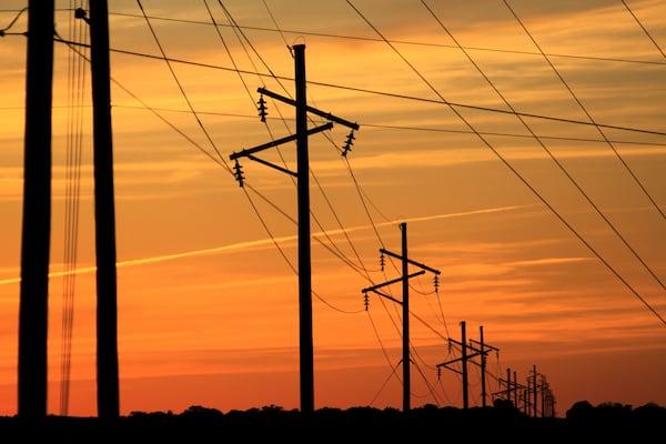 Intersecting transmission lines are pictured near Show Low, Ariz., Tuesday, April 22, 2025. (AP Photo/Susan Montoya Bryan)
