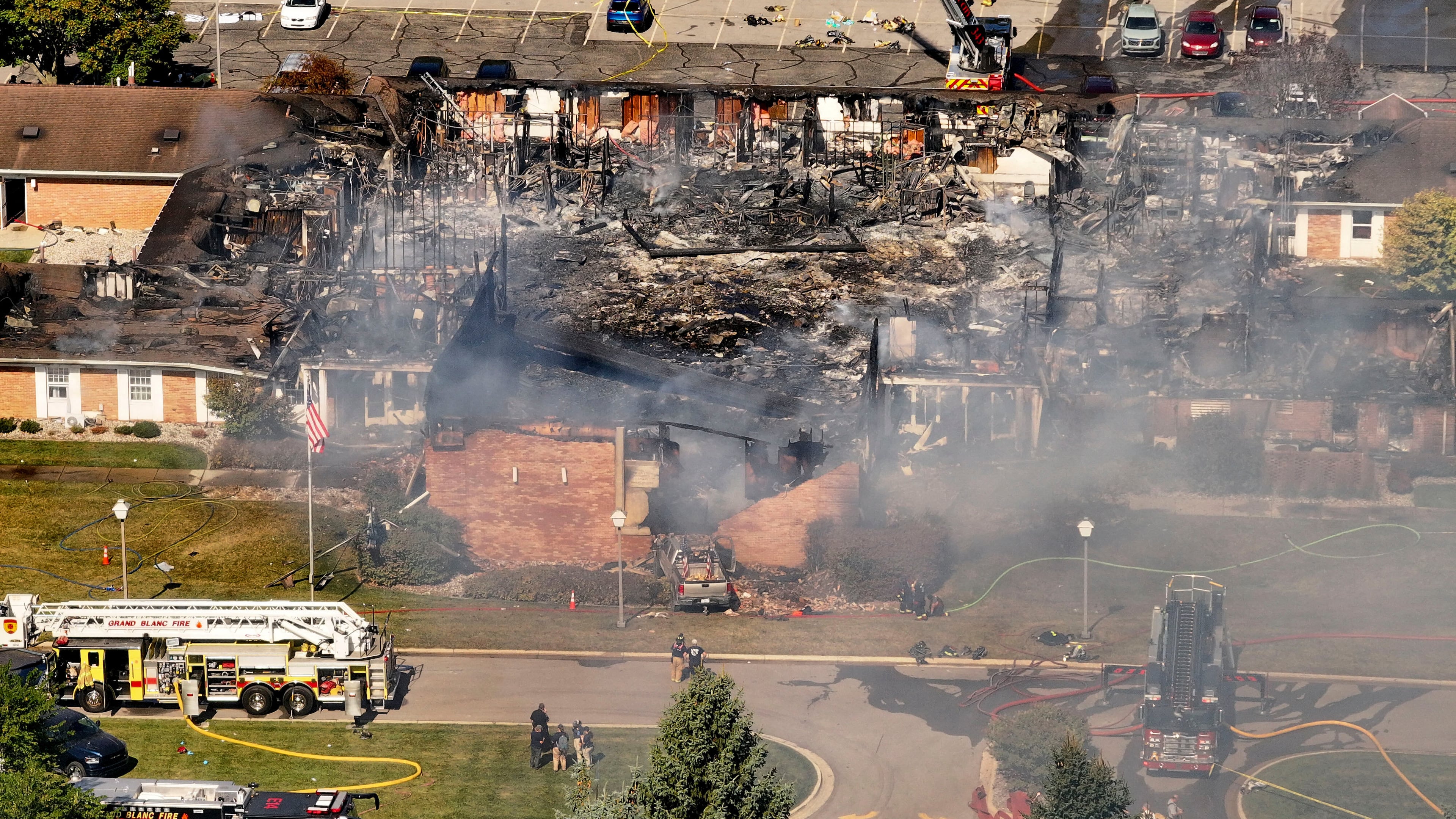 Emergency crews respond to a shooting and fire at The Church of Jesus Christ of Latter-day Saints, in Grand Blanc, Mich., Sept. 28, 2025. (David Guralnick/Detroit News via AP)