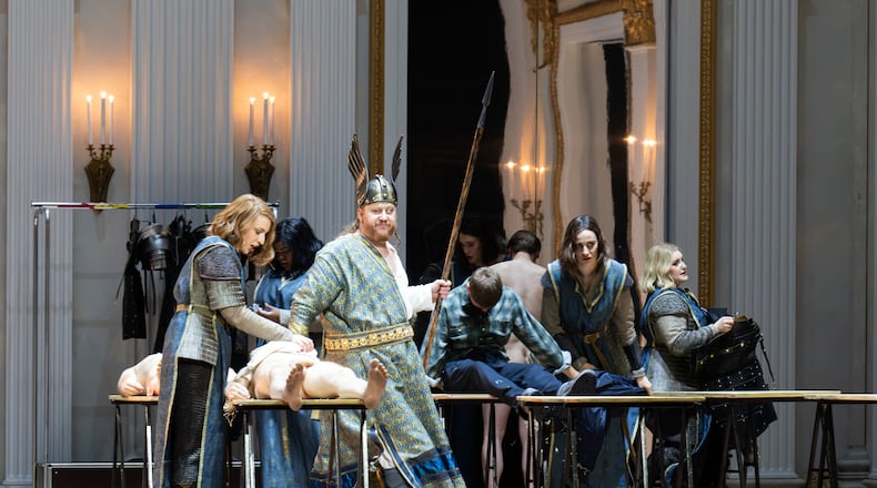 Bass-baritone Nicholas Brownlee portrays Wotan, second left, as he is surrounded by cast members portraying Wotan's Valkyrie daughters, in a production of Richard Wagner’s “Die Walkuere” at the Bavarian State Opera in Munich. (Monika Rittershaus/Bavarian State Opera via AP)