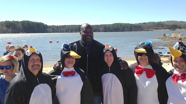 Shaquille O’Neal (the tall guy) poses with five Dalton police officers (the ones dressed as penguins) at Special Olympics Georgia's Polar Plunge event at Lake Acworth on Feb. 25, 2017.