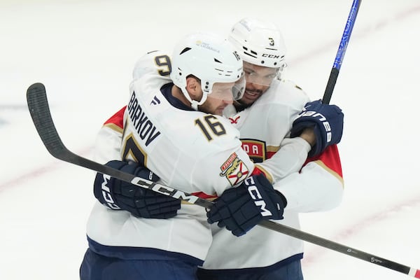 Florida Panthers defenseman Seth Jones (3) celebrates after his goal with teammate Aleksander Barkov (16) during the second period of Game 7 of a second-round NHL hockey playoff series in Toronto, Sunday, May 18, 2025. (Chris Young/The Canadian Press via AP)