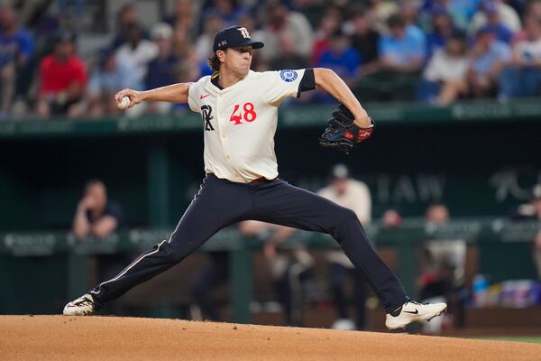 Texas Rangers starting pitcher Jacob deGrom throws a pitch to the Los Angeles Dodgers during the second inning of a baseball game Friday, April 18, 2025, in Arlington, Texas. (AP Photo/Julio Cortez)