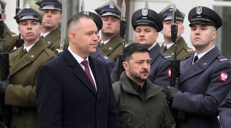 FILE - Polish President Karol Nawrocki, left, and Ukrainian President Volodymyr Zelenskyy attend an official welcome ceremony before their meeting at the Presidential Palace in Warsaw, Poland, Dec. 19, 2025. (AP Photo/Czarek Sokolowski, File)